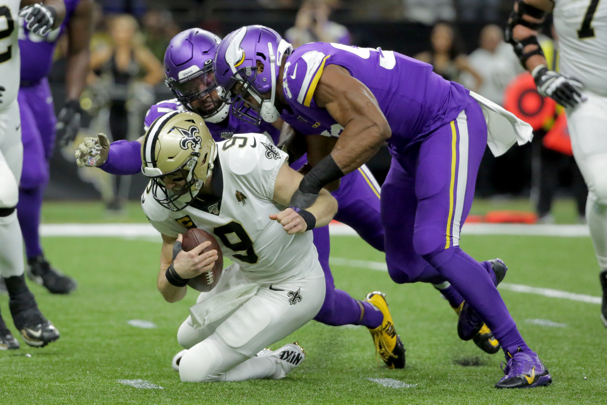 Jan 5, 2020; New Orleans, Louisiana, USA; Minnesota Vikings defensive end Everson Griffen (97) and defensive end Danielle Hunter (99) sack New Orleans Saints quarterback Drew Brees (9) during the first quarter of a NFC Wild Card playoff football game at the Mercedes-Benz Superdome. Mandatory Credit: Derick Hingle-USA TODAY Sports